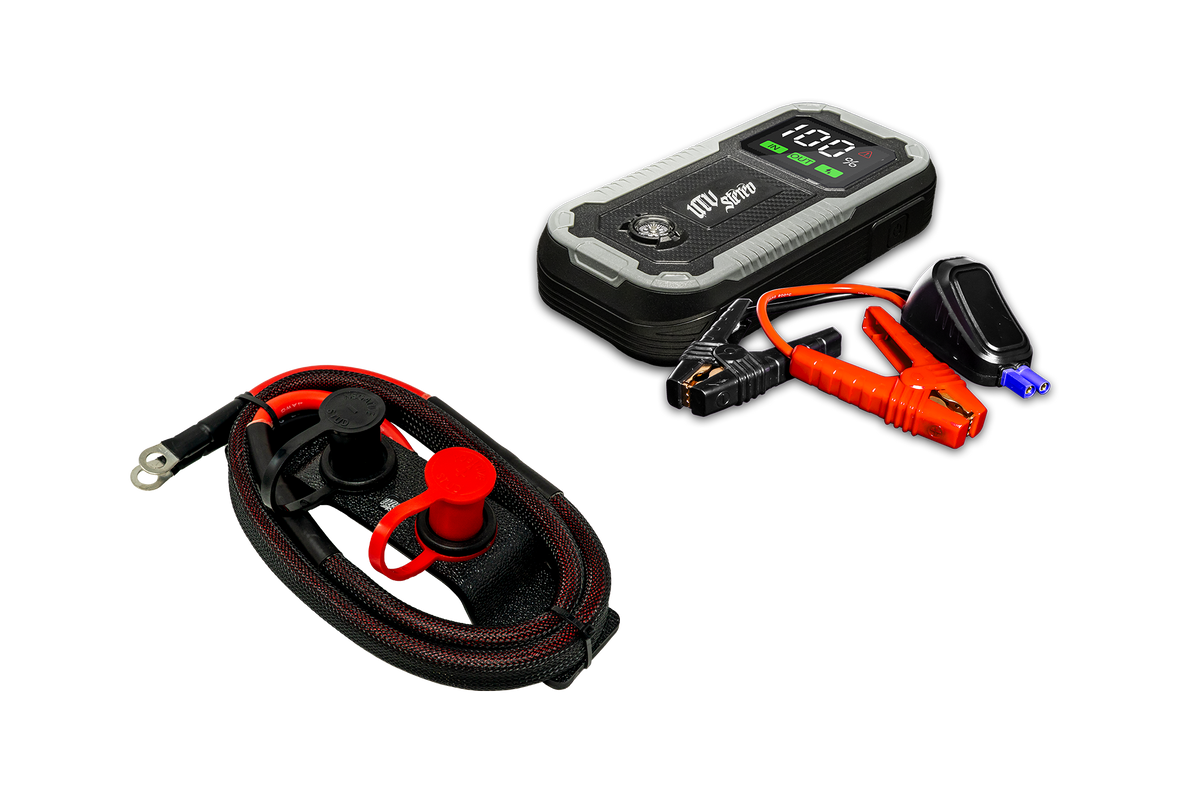 UTV Stereo portable jump starter battery pack with jumper cables and remote charging terminal