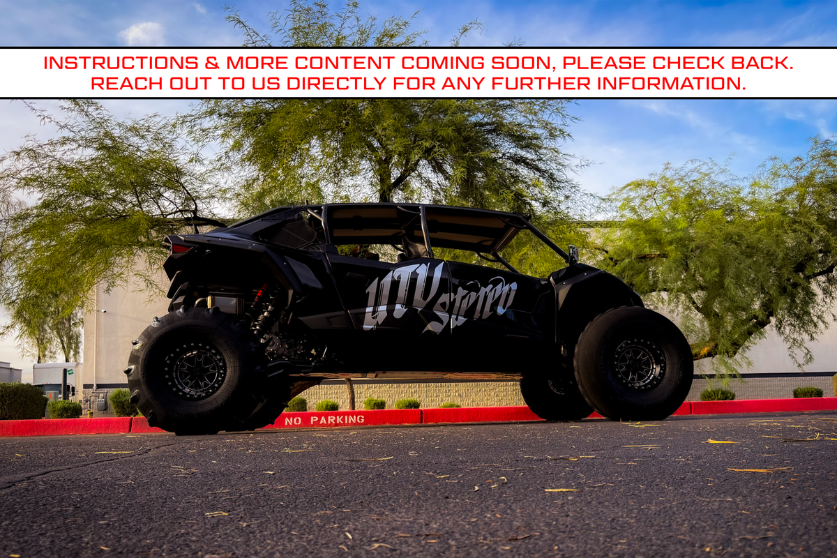 Black UTV Stereo branded off road vehicle parked on asphalt