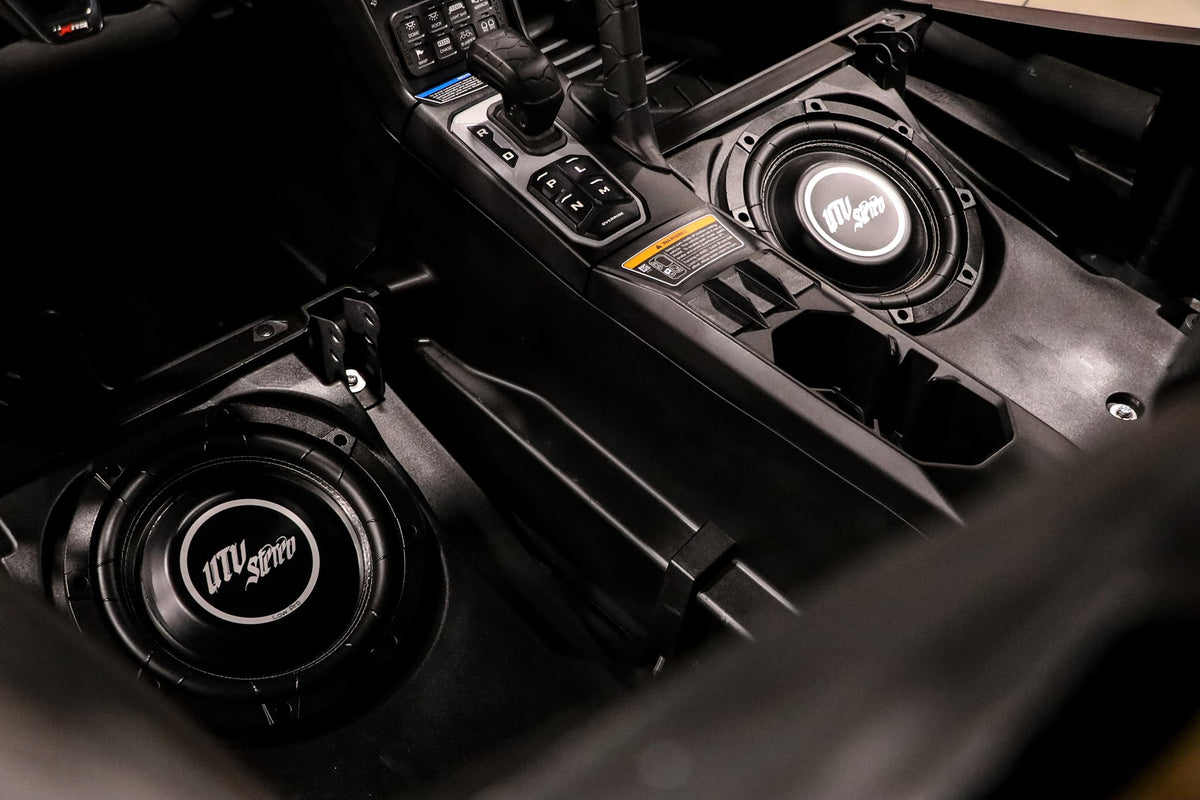 UTV Stereo subwoofers installed in a vehicle center console