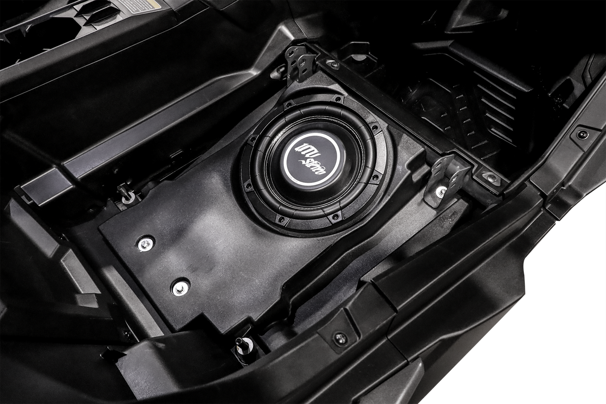 UTV Stereo subwoofer installed in a vehicle storage compartment