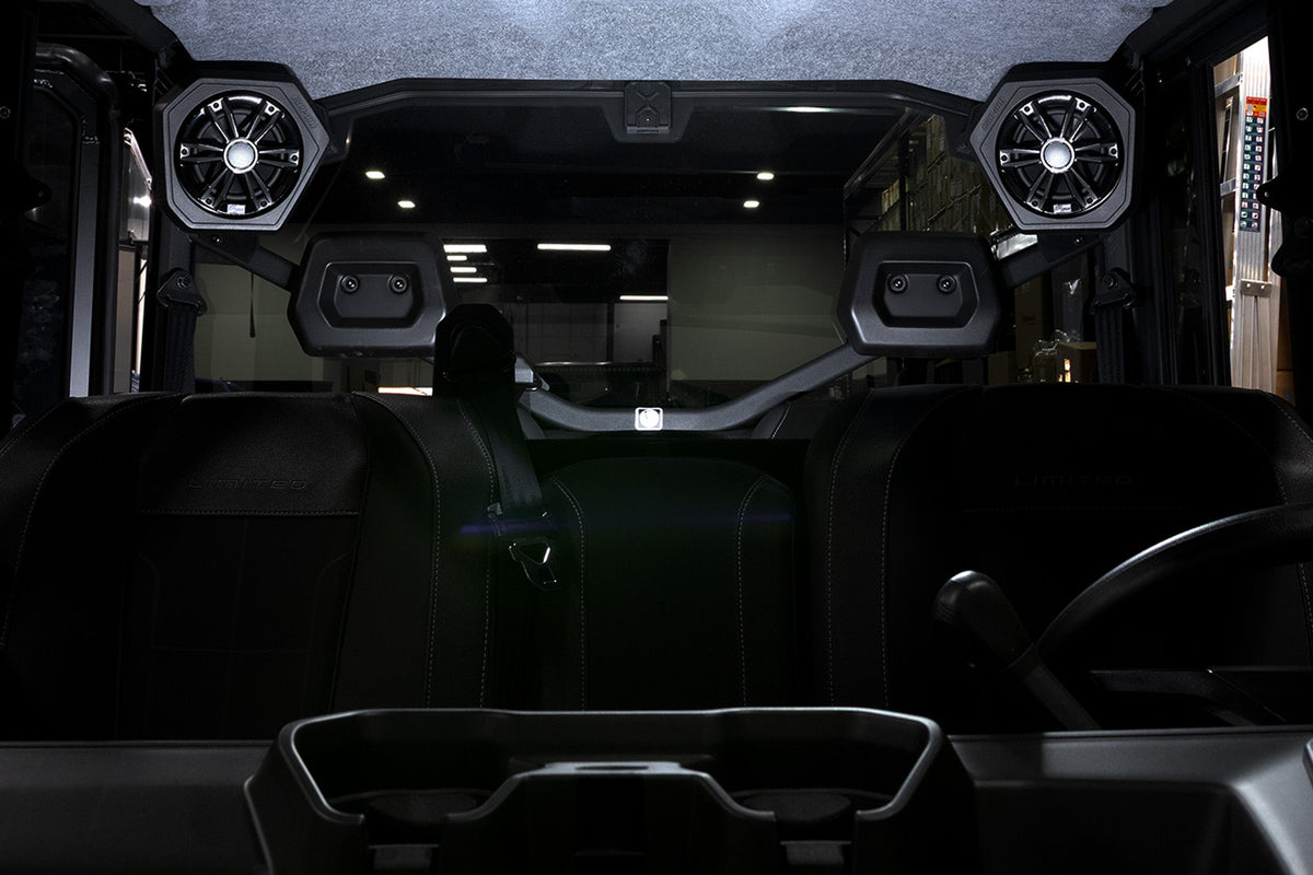 Can-Am off-road vehicle interior with overhead mounted audio speakers