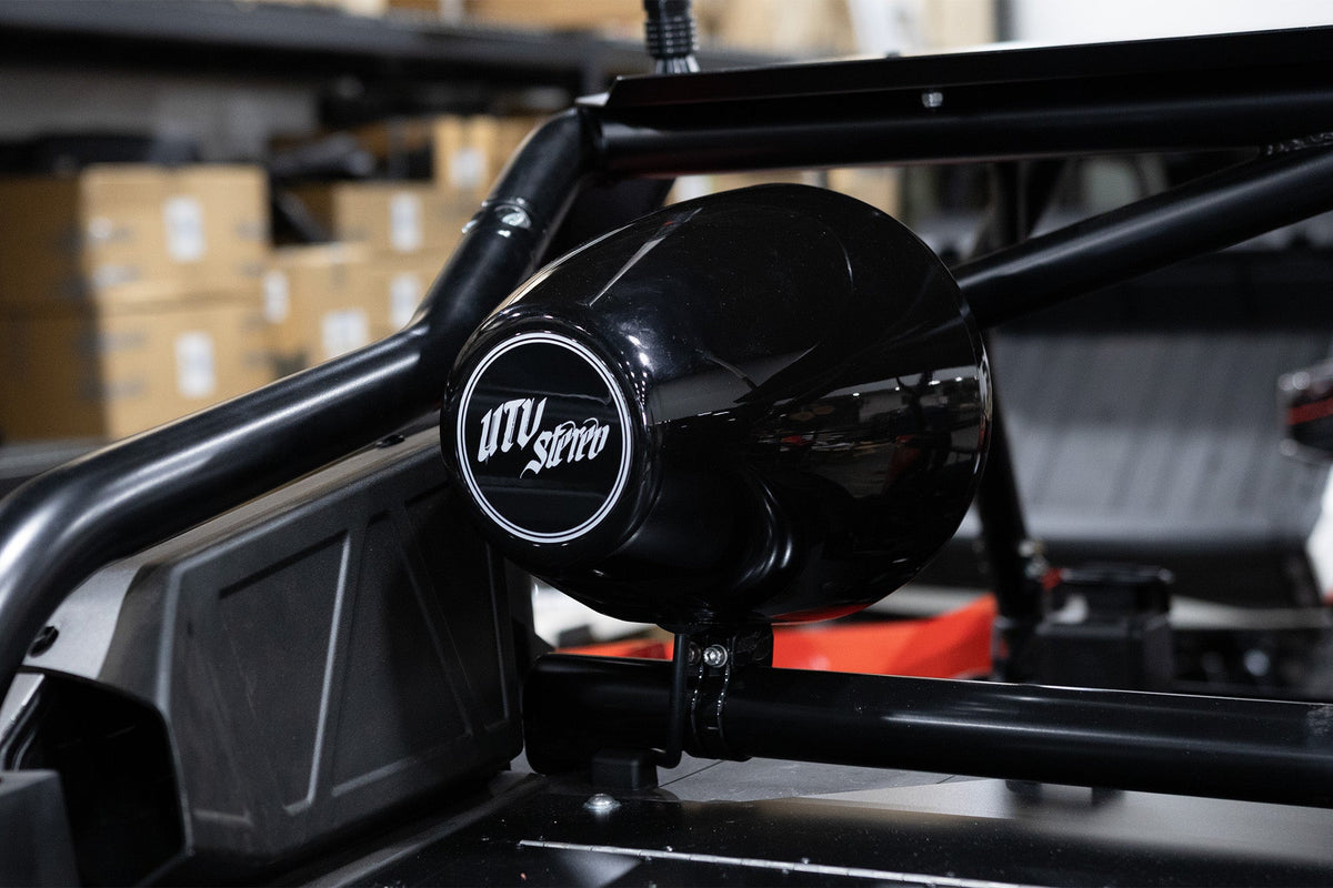 UTV Stereo black pod speaker mounted on a roll cage