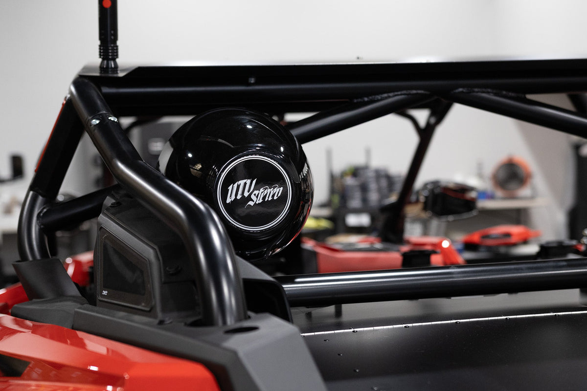 UTV Stereo speaker pod mounted on a black roll cage