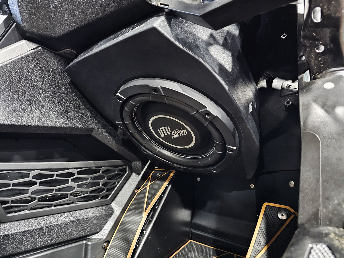 UTV Stereo subwoofer installed in a vehicle interior