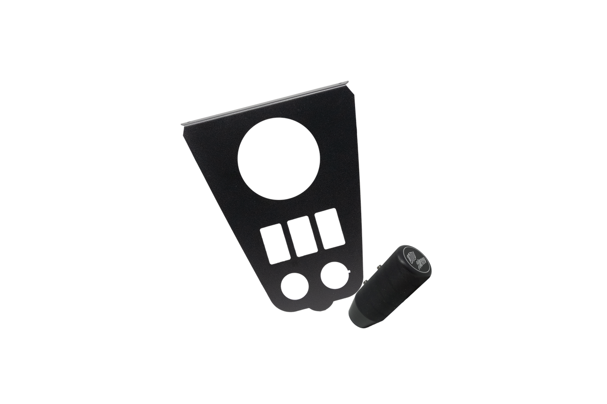 Black metal switch panel with gauge cutout and cylindrical textured knob