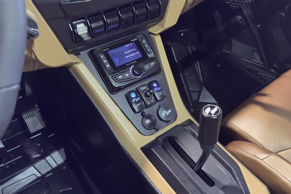 UTV Stereo head unit and control switches installed in vehicle center console