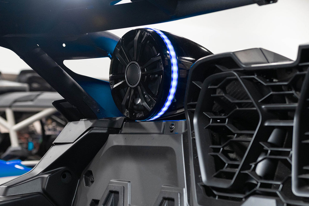 UTV Stereo speaker with blue LED ring mounted on a vehicle roll cage