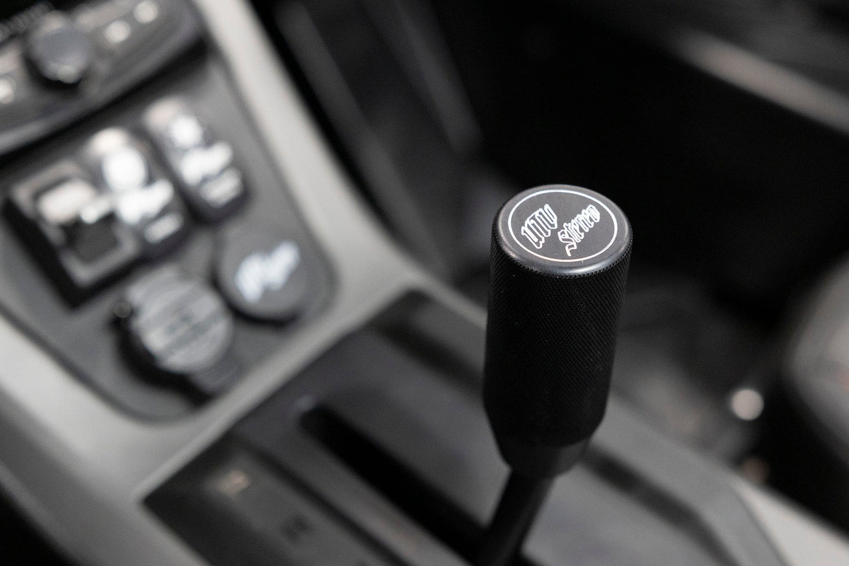 UTV Stereo branded black gear shift knob in vehicle interior