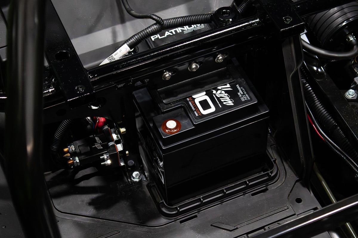 V Stereo 12V battery installed in a vehicle chassis
