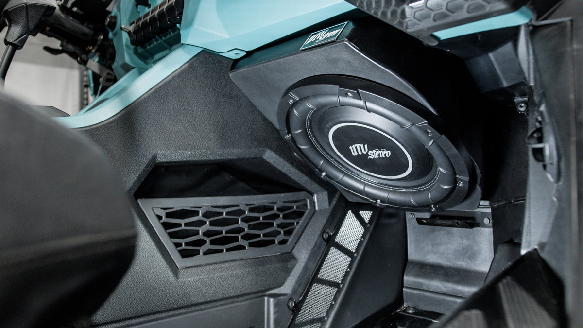 UTV Stereo subwoofer installed in a vehicle dashboard